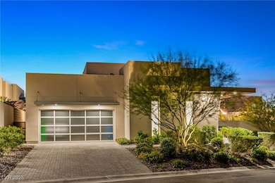 View of front of home featuring driveway, an attac