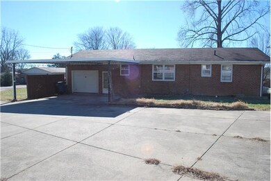 Large Concrete Parking- Turn around Room with Basketball Goal- Driveway also goes around Home