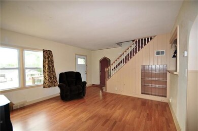 Living room showing off the built in cabinet and t