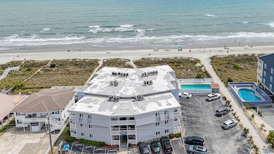 Bird's eye view with a view of the beach and a wat