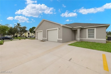 View of front of house featuring stucco siding, an