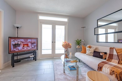 Open floor plan - a French door to bonus room