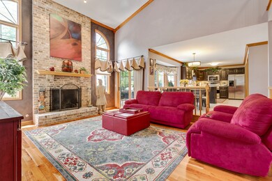 The two-story family room with vaulted ceiling and