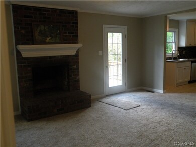 Family room view from foyer, open to kitchen