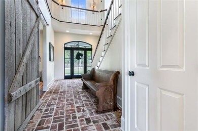 Welcoming entrance hall with soaring ceilings
