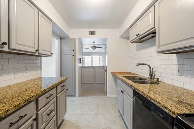 The kitchen is updated with granite and butcher bl