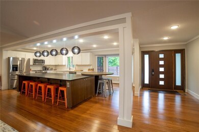 Huge custom island with storage on every side and a built in dining table.