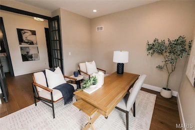 Office featuring dark wood finished floors and recessed lighting