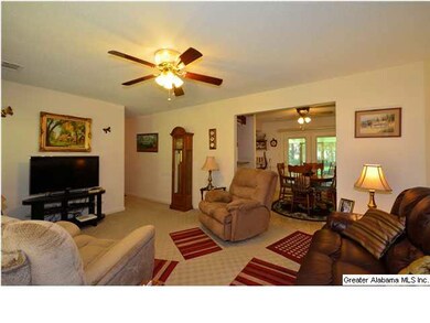 Living room opens to dining and kitchen.