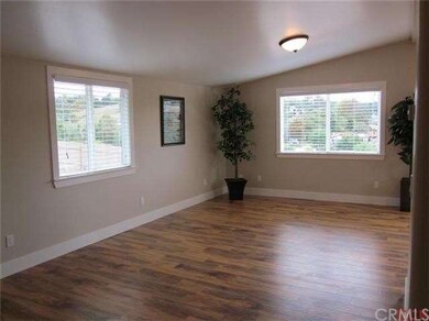 Laminate wood floors, baseboards, new windows and 