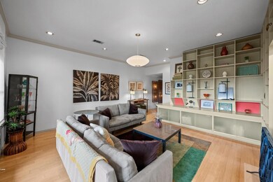 Living area featuring wood finished floors, reces