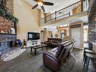 The two-story high family room includes 100 year old Chicago brick on the fireplace with a working fountain!