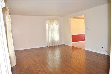 Large living room with hardwood floors