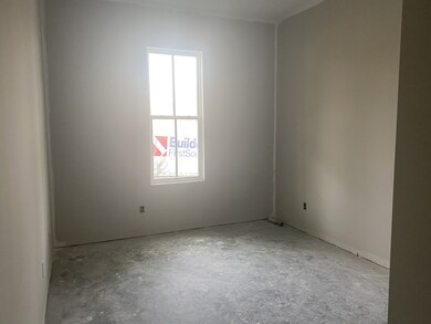 The guest room in this home is private from the master in its own little hallway.