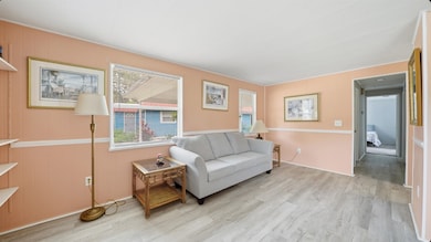 Living area featuring light wood-style flooring