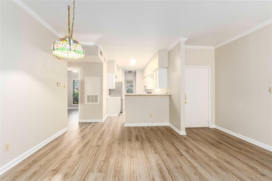 Unfurnished living room featuring light wood-styl