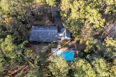 Aerial view. Property goes beyond the fenced in ya