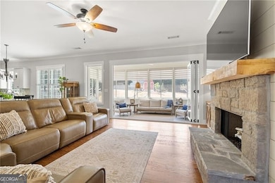 Everyday Elegance - With its thoughtful layout and bright sunroom views, this living space feels as functional as it is beautiful.
