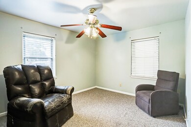 A view of one of two of the secondary bedrooms.
