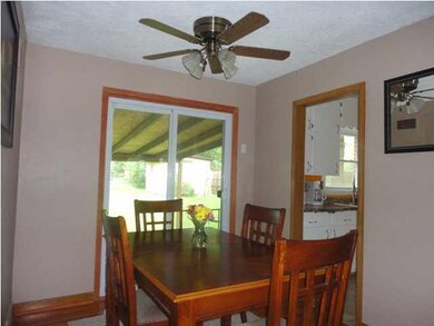 View of dining room with hardwood floors, sliding 