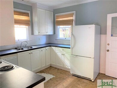 Bead board throughout kitchen. Overlooks private b