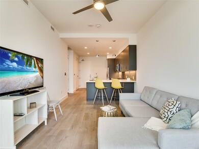 Living room featuring light wood-style flooring, 