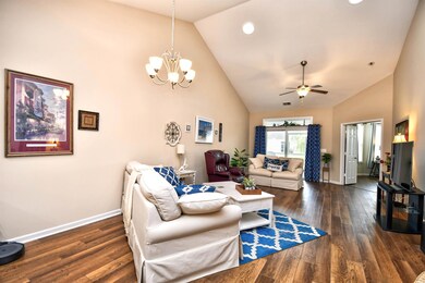 Living room with dark hardwood / wood-style floori