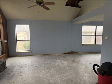 Unfurnished room featuring lofted ceiling, ceiling