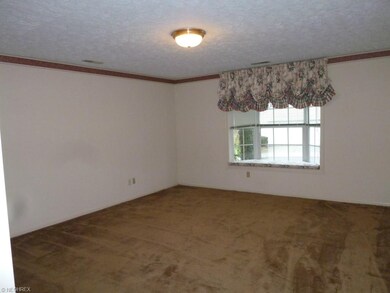 Master bedroom with bay window and window seat