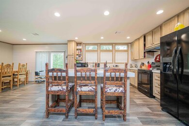 Dining space featuring visible vents, wood finishe