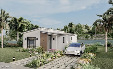 View of front facade with driveway, a water view,
