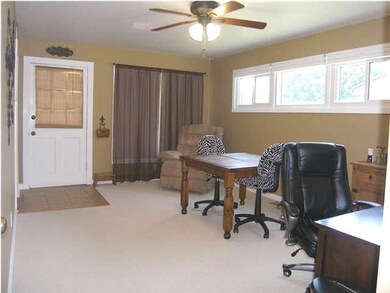 An alternate photo of the living room and front do