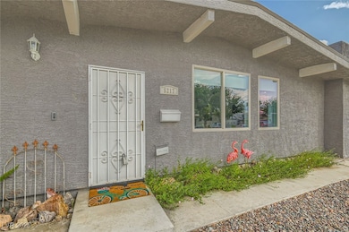 Doorway to property featuring stucco siding