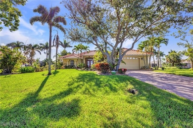 Mediterranean / spanish-style home with an attache
