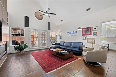 Living room featuring high vaulted ceiling, ceili