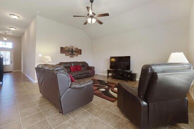 living area boasting high ceilings, NO CARPET here