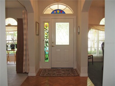 Foyer with  wood flooring and leaded door