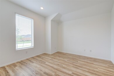 Spare room with light wood-type flooring and rece