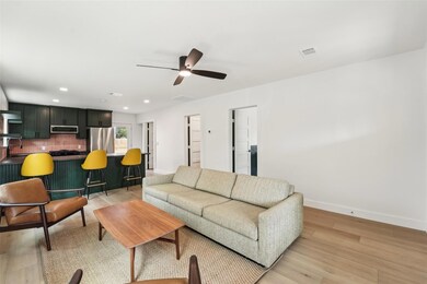 Living room featuring ceiling fan, recessed light