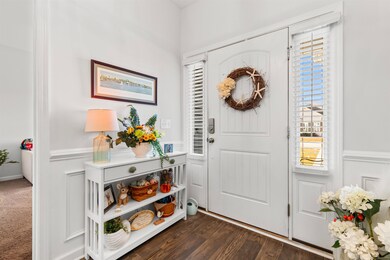 Entryway with dark wood-type flooring