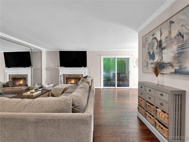 Living room with dark hardwood / wood-style floors