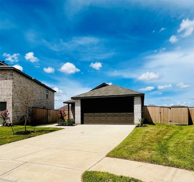 Two car garage with ample parking space