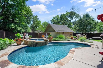 View of swimming pool with a patio area and an in ground hot tub