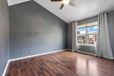 Empty room featuring ceiling fan, lofted ceiling,
