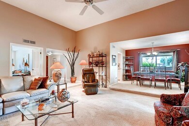 VIEW OF LIVING ROOM AND DINING ROOM