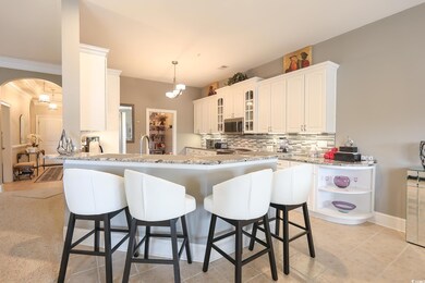 Kitchen featuring open shelves, stainless steel mi
