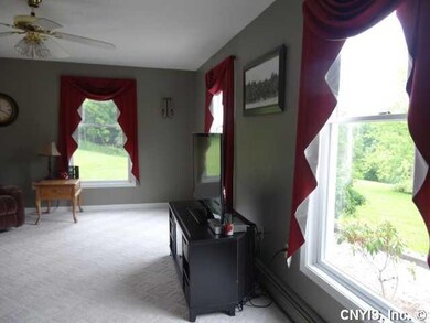 Living Room Oversize windows let the sunshine in!
