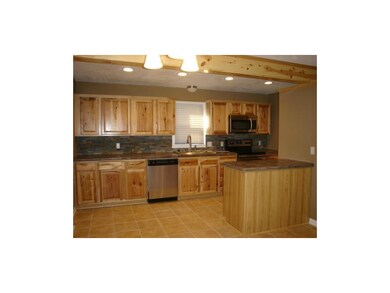 Concrete countertops! Tile floor! Island! All appl