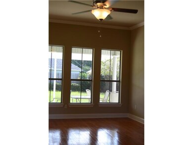 Living Room. Wall of windows overlooking covered p