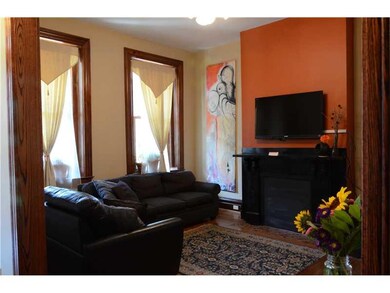 Living Room. Extra wide original wood baseboards a